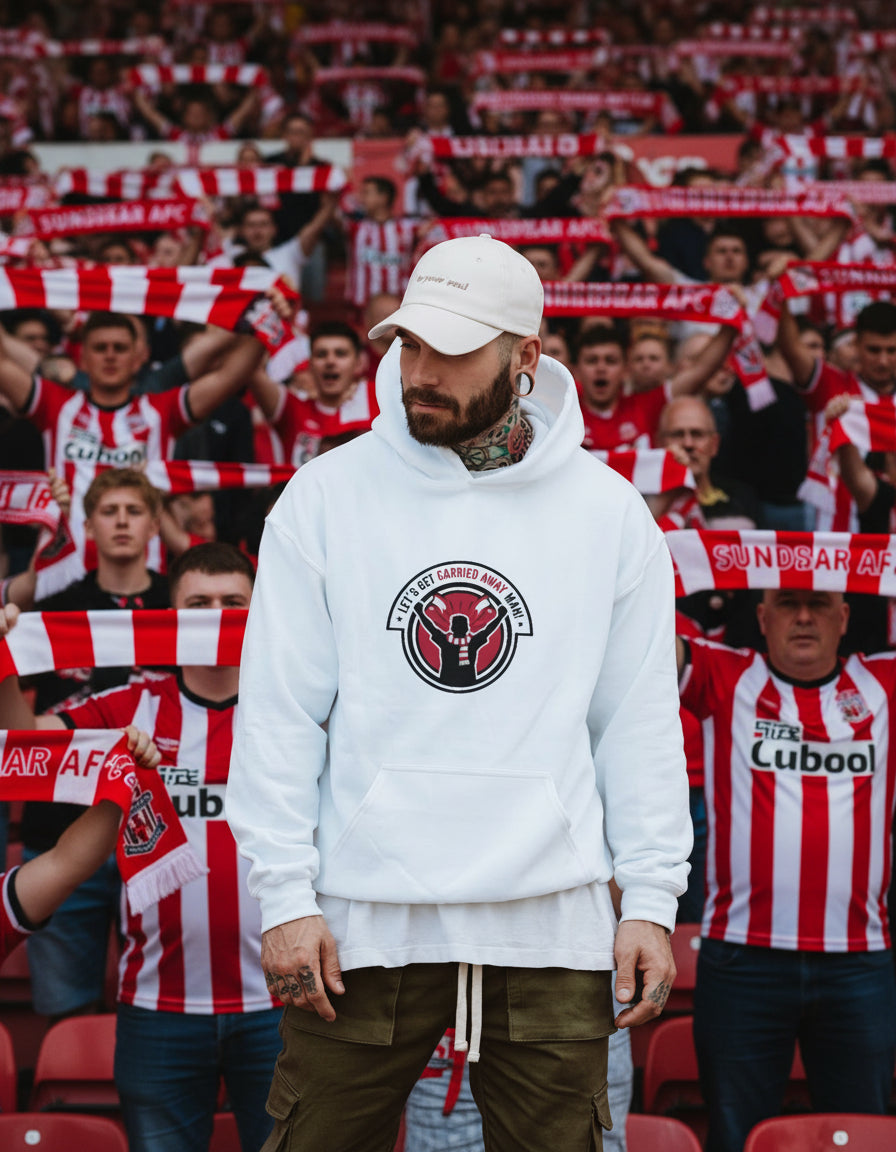 Man wearing a white hoodie with a logo against in front of a crowd of sunderland afc fans