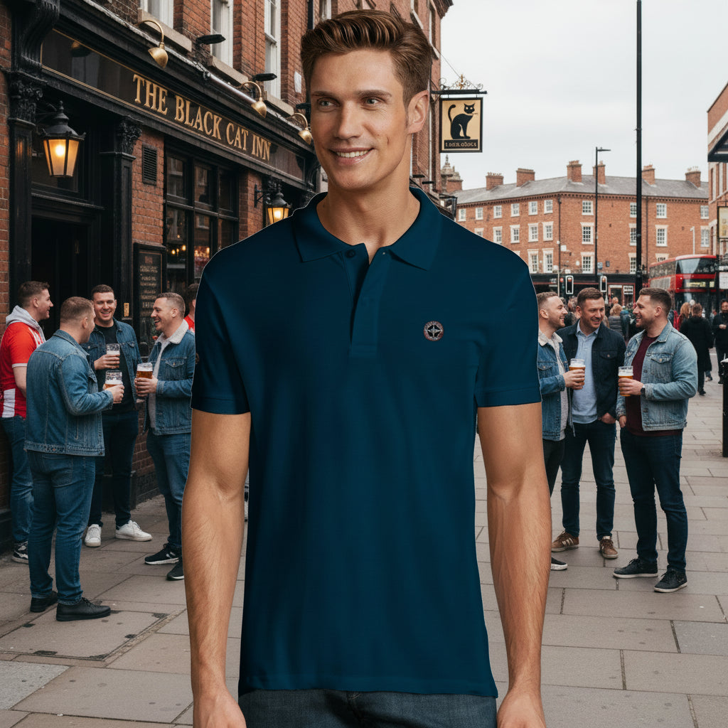 Man wearing a dark blue polo shirt with a small logo on a white background